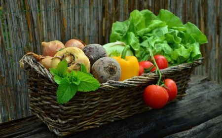 A basket of beetroot parsnips tomatoes peppers and lettuce to support a healthy gut